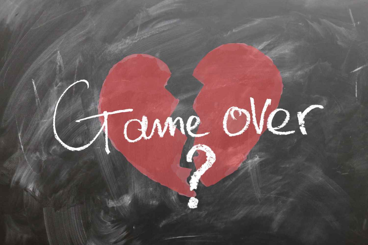 game over broken heart on chalkboard
